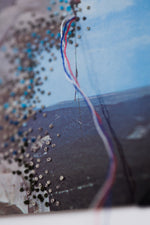 By a Thread