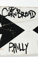 Cornbread Philly Sign (black arrows)